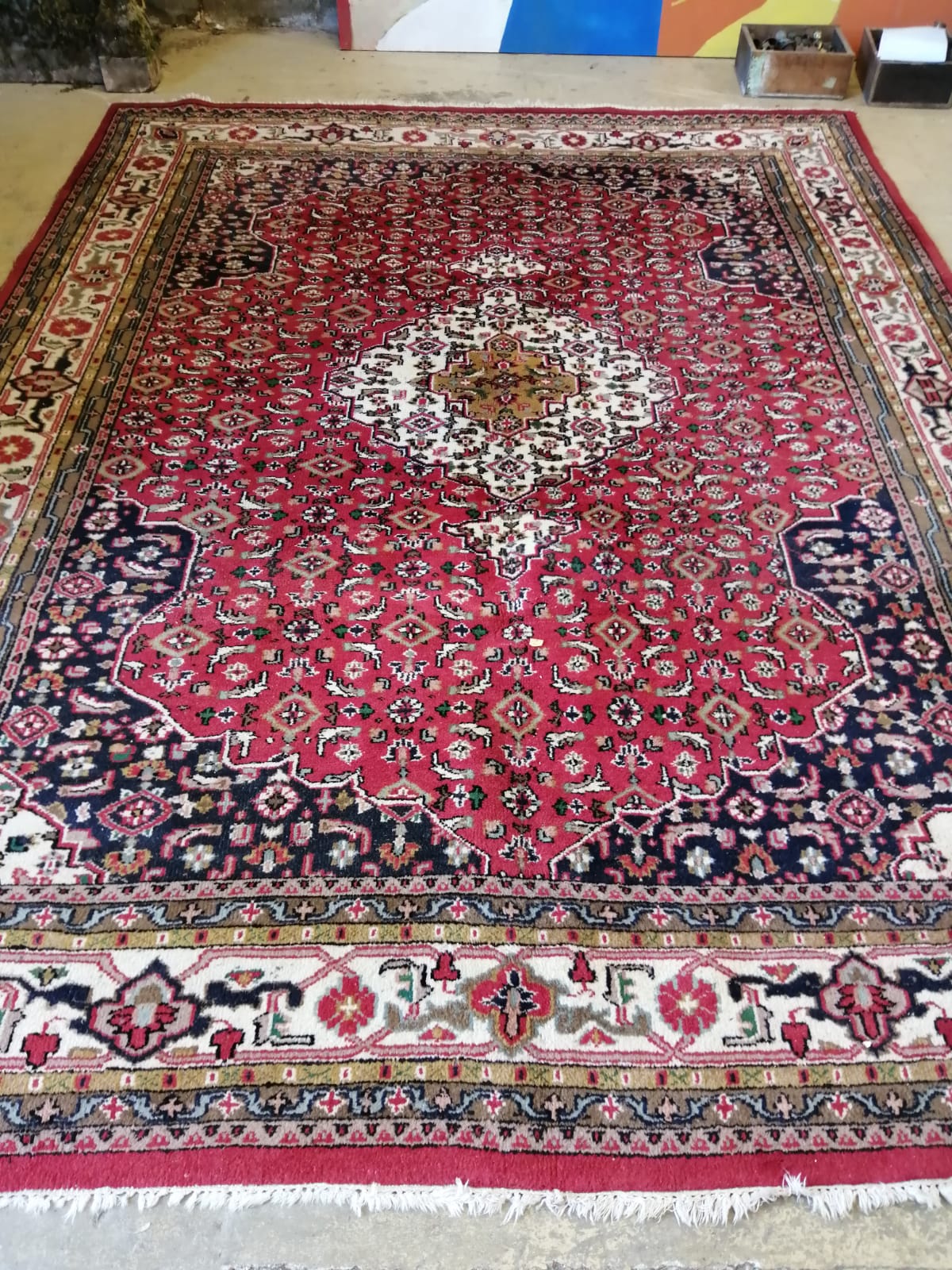 A North West Persian red ground carpet, 350cm x 260cm